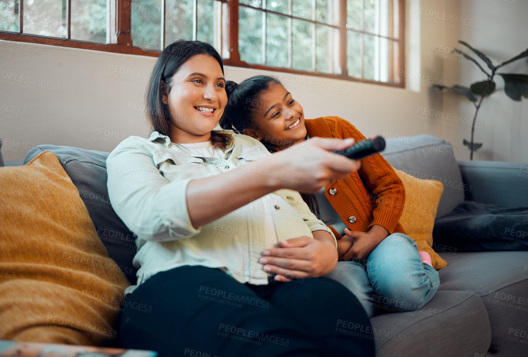 Buy stock photo Relax, pregnant woman and girl watching tv, film or movies on sofa with remote control for a fun television. Happy family, pregnancy or mother streaming or enjoying entertainment with child at home