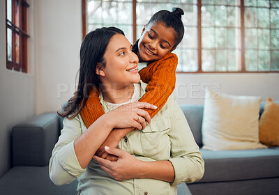Buy stock photo Mom, girl and hug by sofa in living room, family home and happy together for love, bonding and care. Happiness, mother and daughter with embrace, trust and smile as happy family at house in Mexico