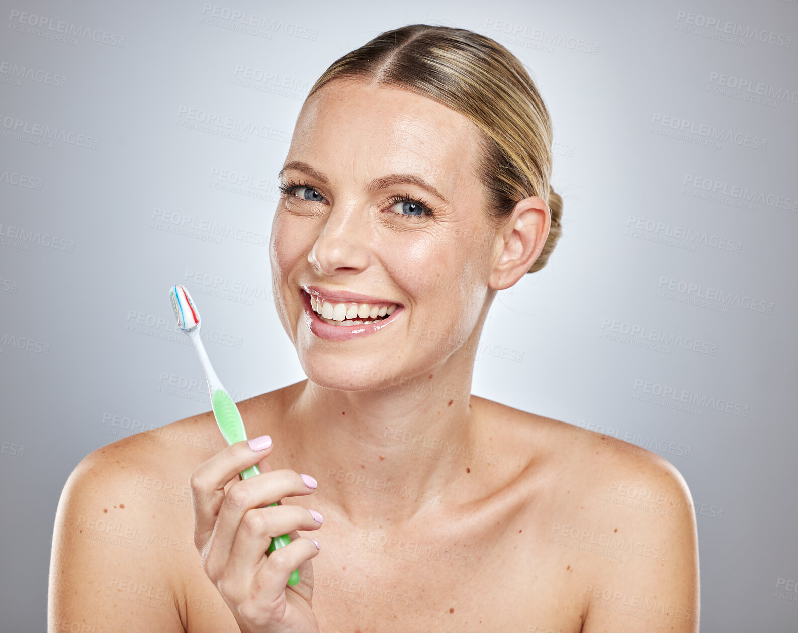 Buy stock photo Face, teeth and woman with toothbrush in studio isolated on a gray background. Oral health, dental veneers and female model getting ready to brush with toothpaste for hygiene, cleaning and wellness.