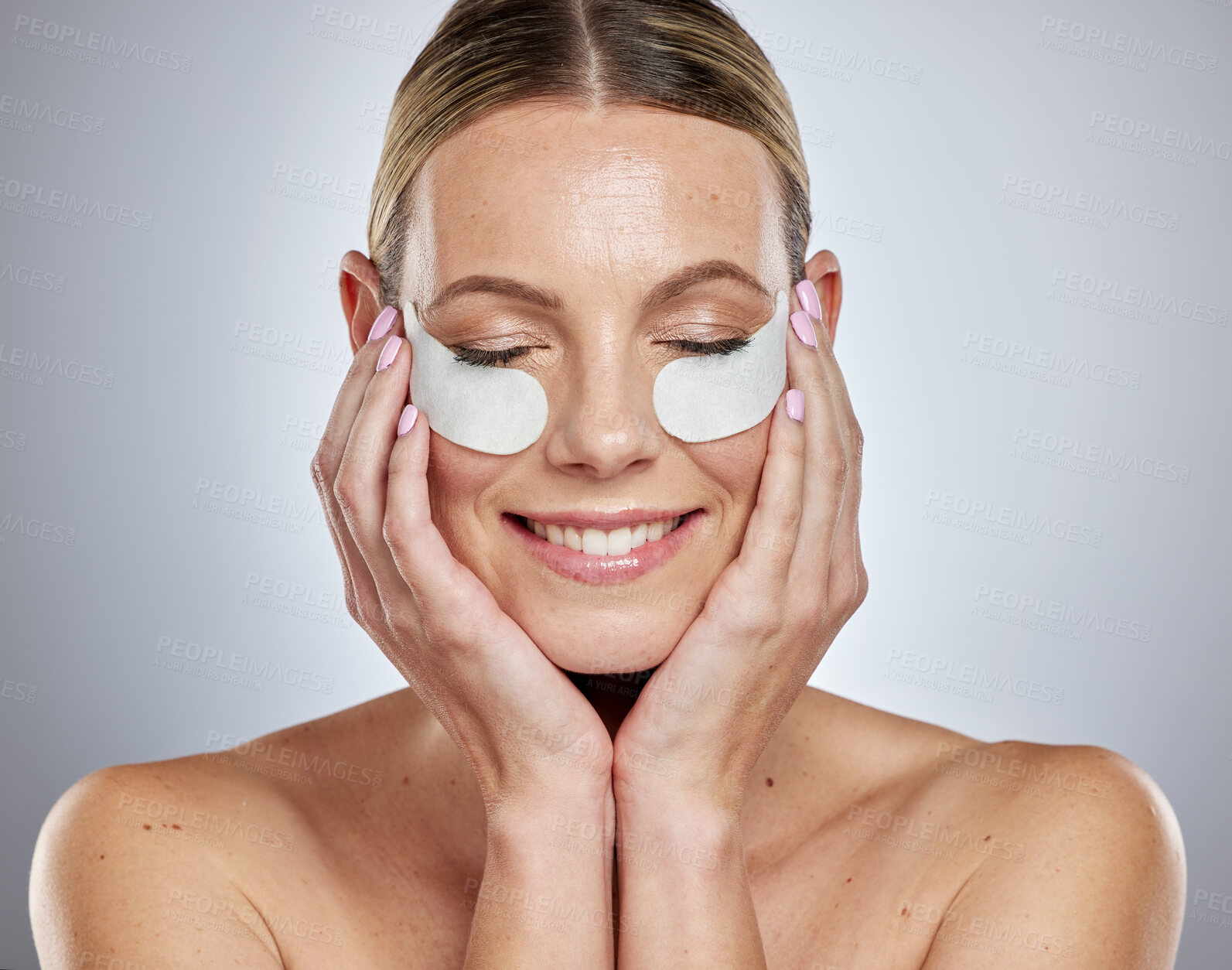 Buy stock photo Woman, eyes mask and skincare portrait with hands in studio for beauty wellness, luxury facial care or cosmetics dermatology. Happy Australian girl, face skin hydration and anti aging eye patches 