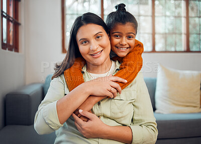 Buy stock photo Family, portrait and mother with girl on a sofa embrace, relax and smile in their home together.  Face, mom and child hugging on a couch, enjoying bond, weekend and quality time in a living room