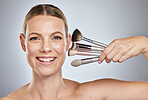 Woman, makeup brushes and portrait smile for cosmetics, beauty or facial treatment against a studio background. Happy face of female model smiling in skincare holding makeup tools for self care