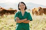 Woman, vet or arms crossed on cow farm, dairy agriculture field or beef produce countryside in wellness goals or vaccine innovation. Portrait, smile or happy animal doctor in bovine cattle healthcare