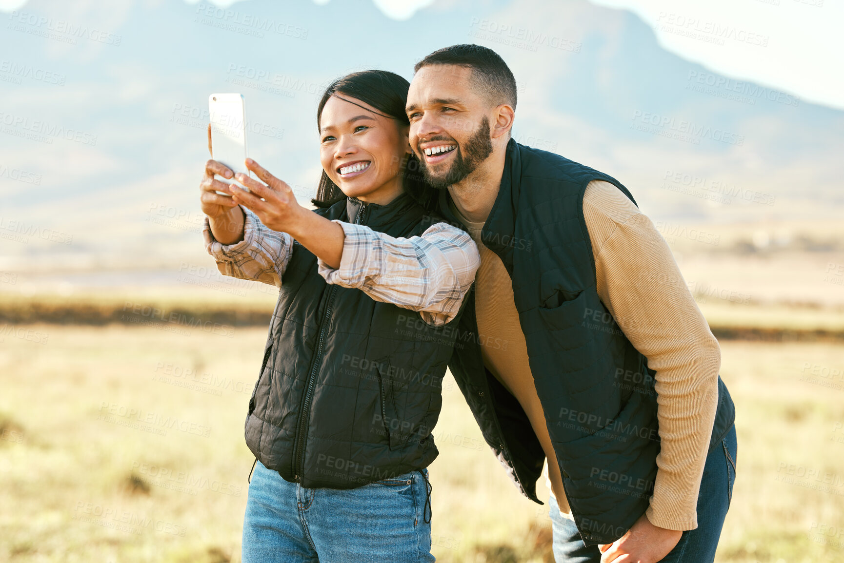 Buy stock photo Selfie, couple and travel to countryside, outdoor and happy with phone for photography on holiday in outback Australia. Memory, smile in picture and smartphone, adventure and happiness with freedom.