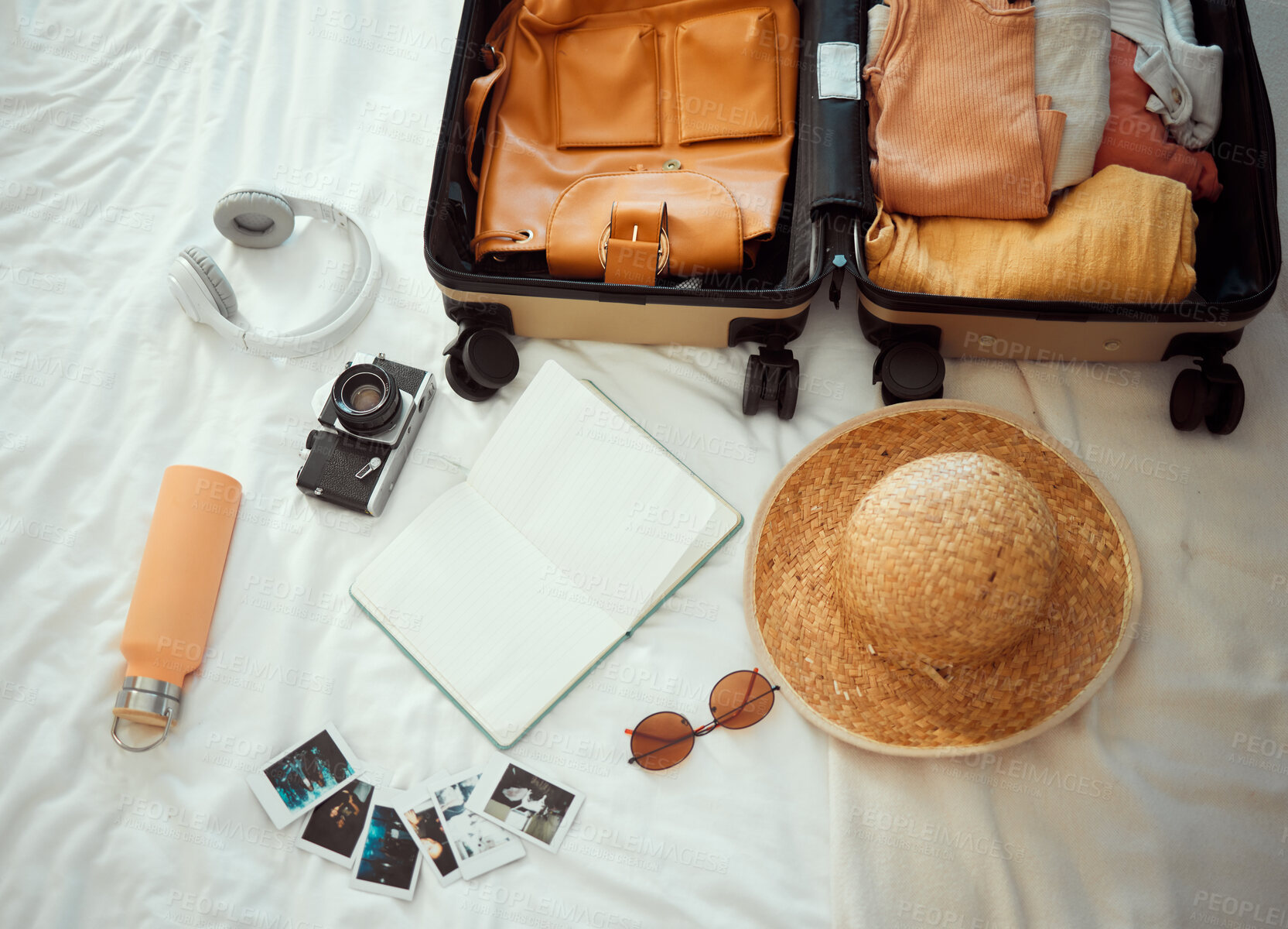 Buy stock photo Backpacking, suitcase and equipment for summer travel, vacation or holiday getaway kit preparation on bed. Tourism, packing and items for traveler, trip or tourist adventure, explorer gear in bedroom