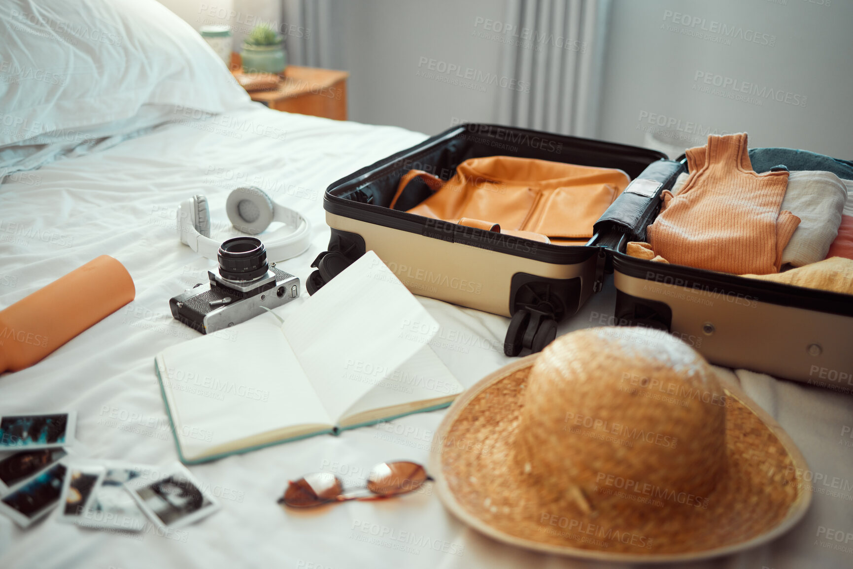 Buy stock photo Travel, luggage and bedroom with a suitcase, hat and camera on a bed in a hotel during holiday or vacation. Hospitality, tourist and resort with luggage in a room for traveling or sightseeing abroad
