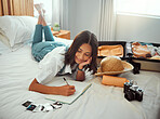 Bed, woman and book for writing before travel, vacation and adventure, diary and memories in her home. bedroom, journal and girl write notes of travelling, journey and experience after holiday abroad