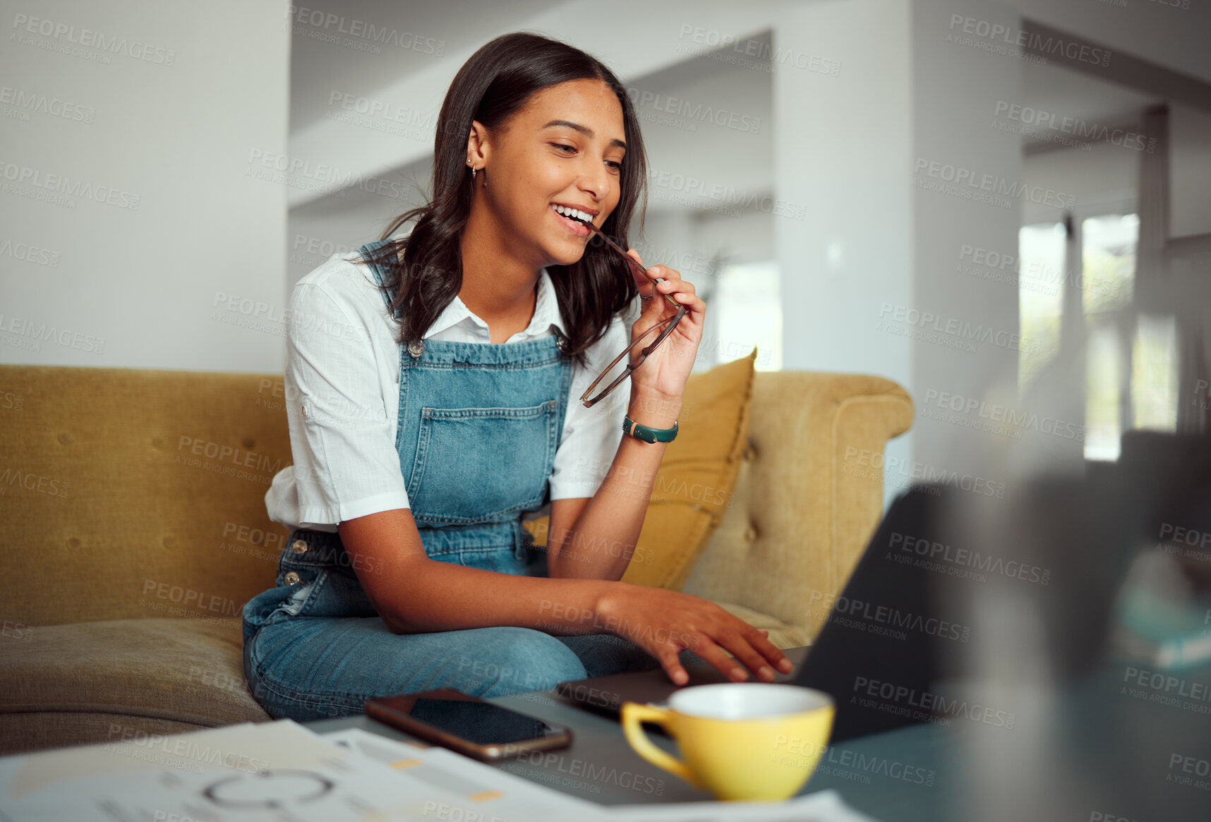 Buy stock photo Woman, laptop and relax on sofa reading online communication, remote work or smile for web conversation. Young girl, typing on computer and freelance employee search website on couch in living room