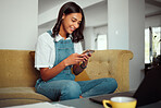 Woman, phone and social media mobile reading of a person relax on a home living room sofa. Internet, web and social network texting of a young female on a house couch scroll through communication app