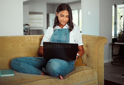 Buy stock photo Woman, laptop or relax on sofa in house or home living room for e learning, education or lockdown study. Smile, happy or student on technology for university homework, college or school scholarship