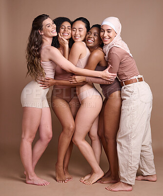Buy stock photo Diversity hug, beauty and body positive women in studio on a brown background. Underwear, skincare and group of different, young or happy female models in makeup with eyes closed posing for self love