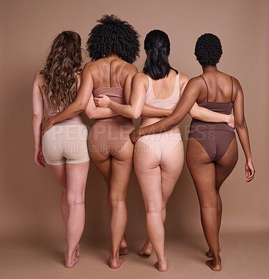 Buy stock photo Back, diversity and body positivity with woman friends in studio on a brown background for natural confidence. Normal, behind and inclusion with a female friend group posing to promote real people