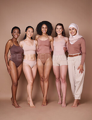 Buy stock photo Beauty, diversity and body positivity with a woman friends together in studio on a brown background for inclusion. Portrait, model and underwear with a female friend group standing proud in unity