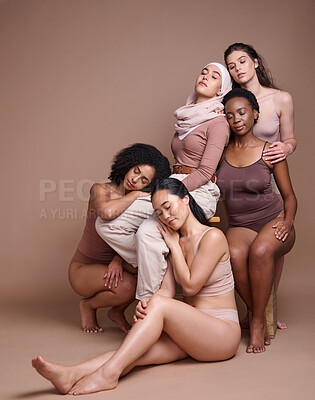 Buy stock photo Diversity, woman and body positive skincare beauty for inclusion, spa dermatology wellness and natural body care in studio. Interracial model friends, support and relax cosmetic equality in underwear