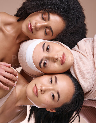Buy stock photo Portrait, beauty and diversity with woman friends in studio on a brown background for skincare or inclusion. Face, pile and natural with a model female friend group posing to promote equality