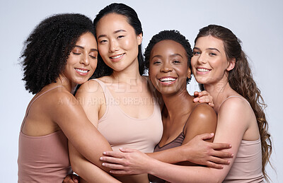 Buy stock photo Skincare, support and diversity of women with a hug for makeup collaboration, cosmetics and beauty on a studio background. Affection, happy and portrait of model friends with cosmetic empowerment