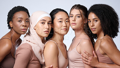 Buy stock photo Beauty, skincare and face of different women group together for diversity, cosmetics and dermatology with glow and shine on skin. Female friends in studio for inclusion, makeup and self love portrait