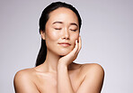 Skincare, asian and beauty woman in studio with calm, zen and sleeping for night facial wellness, health and glow on marketing mockup. Makeup, skincare and Seoul model thinking of cosmetics results