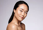 Beauty, skincare and portrait of Asian woman in a studio with a health, wellness and hygiene face routine. Cosmetic, healthy and model with clean, spa and natural facial treatment by gray background.