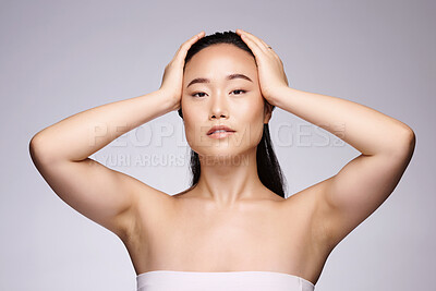 Buy stock photo Asian, beauty and skincare portrait of woman with hair removal, body care or dermatology cosmetic treatment for armpit. Health, natural and confident model aesthetic pose in gray studio.