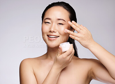 Buy stock photo Woman, face or skincare glow with cream on studio background in dermatology wellness, collagen healthcare or Japanese grooming. Portrait, smile or happy beauty model with facial sunscreen or retinol