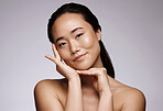 Portrait, Asian woman and cosmetics for skincare, natural beauty and clean on grey studio background. Female, girl and makeup for organic facial, face detox or wellness for smooth, soft or clear skin