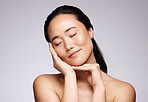Cosmetics, Asian woman and skincare for wellness, natural beauty and shine on grey studio background. Female, girl and makeup for confidence, face detox and organic facial for smooth and clear skin.
