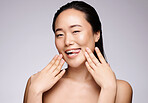 Woman, skincare portrait and beauty in studio, funny face and tongue smile for cosmetic glow by wall. Asian model, happy and makeup with cosmetics facial, wellness and comic for health in by backdrop