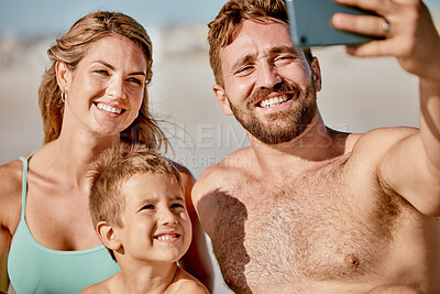 Buy stock photo Happy family in selfie at beach with parents and child on holiday, summer vacation and outdoor wellness for social media post. Profile picture update, smartphone with a mother, father and kid on sand