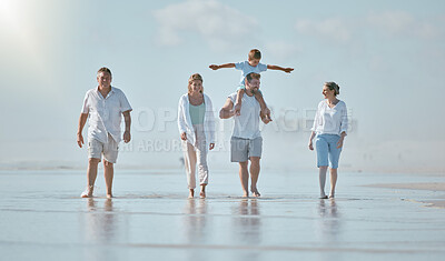 Buy stock photo Walking, freedom and big family at the beach for holiday, travel peace and love at the ocean of Spain. Nature summer, happy and parents, child and grandparents on a walk by the sea during a vacation