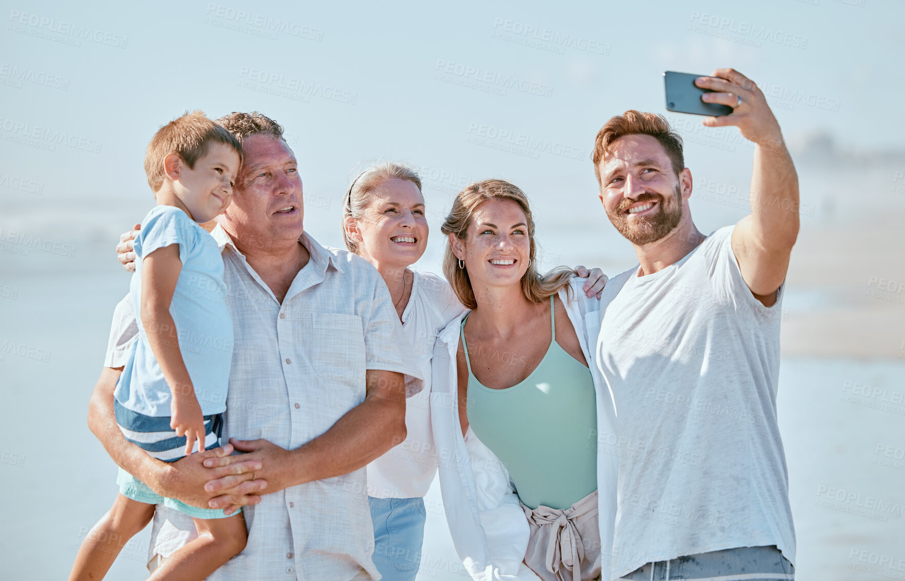 Buy stock photo Selfie, family and beach with children, parents and grandparents posing for a photograph by the sea or ocean. Love, kids and holiday with a man, woman and son taking a picture during summer vacation