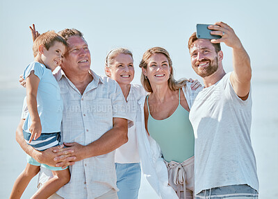 Buy stock photo Love, beach and phone selfie of happy family in outdoor nature for peace, freedom and bonding quality time. Picture memory, summer holiday and big family of parents, grandparents and child in Canada