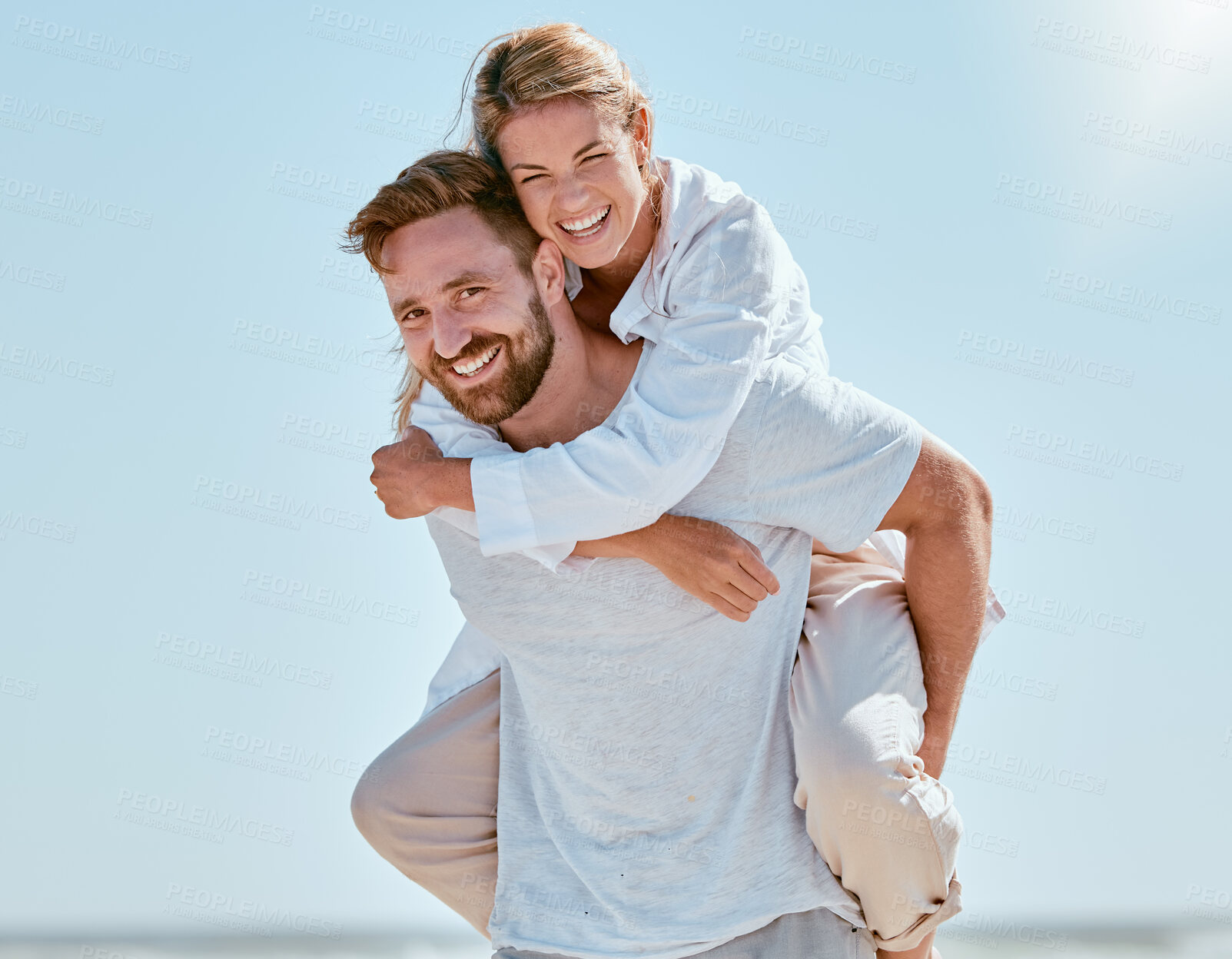 Buy stock photo Love, couple and piggy back on vacation, smile and playful together outdoor. Mockup, man and woman bonding, romantic and loving on holiday, summer and fun for relationship, quality time and portrait.