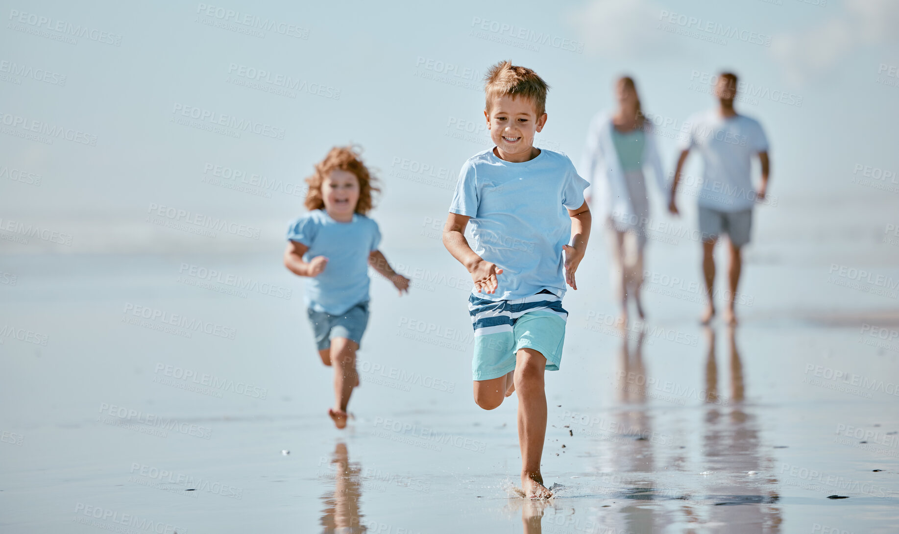 Buy stock photo Children, running and beach with a brother and sister together on the sand by the sea or ocean during summer. Family, travel and fun with sibling kids on the coast with their parents for holiday