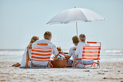 Buy stock photo Beach, umbrella and big family on a summer vacation, trip or seaside journey together in Australia. Travel, relax and children on a holiday adventure with their grandparents and parents by the ocean.
