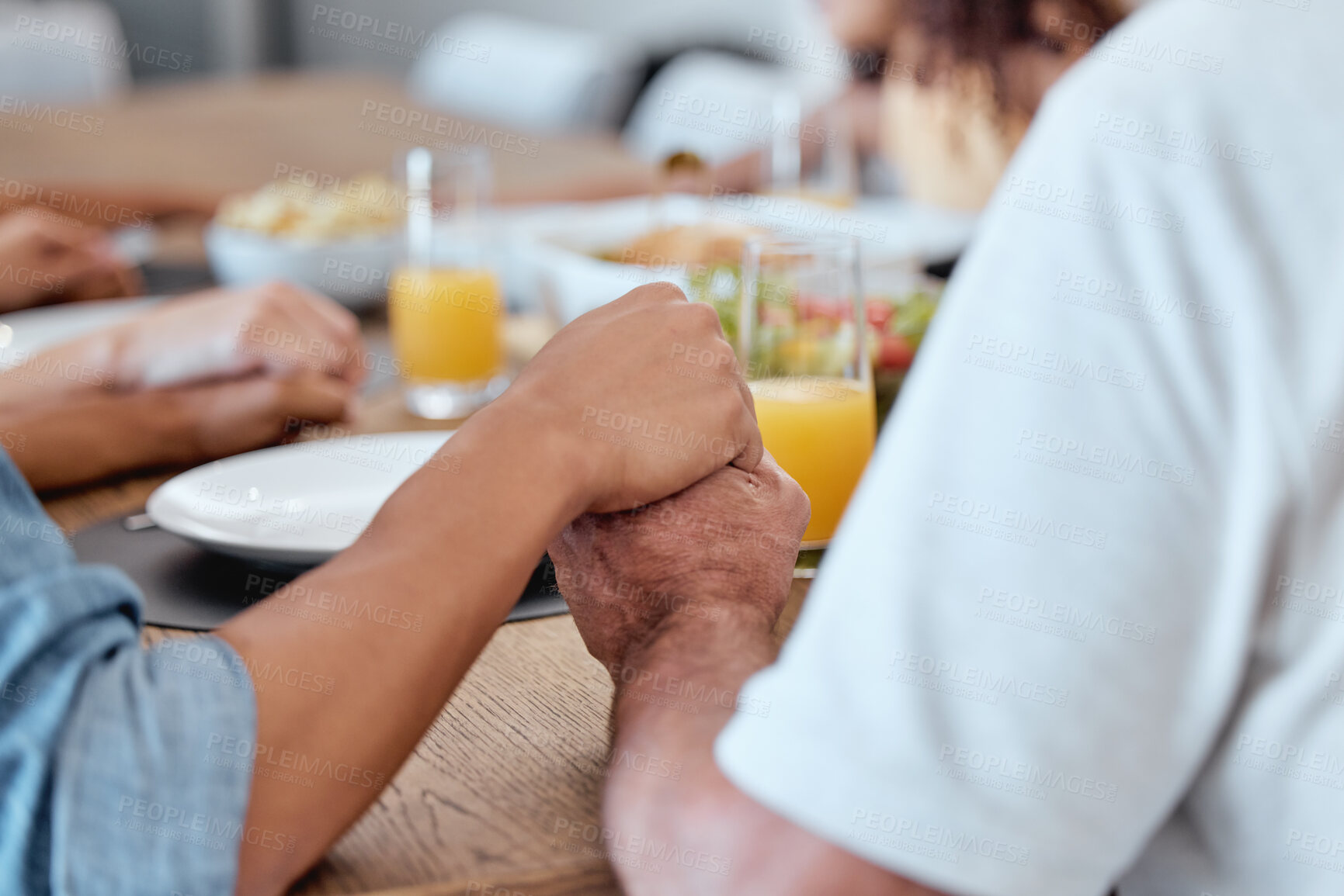 Buy stock photo Family, holding hands and praying for Thanksgiving dinner, New Year lunch or Christmas meal in religion routine, tradition and worship. Zoom, bonding man and woman praying for food in house or home