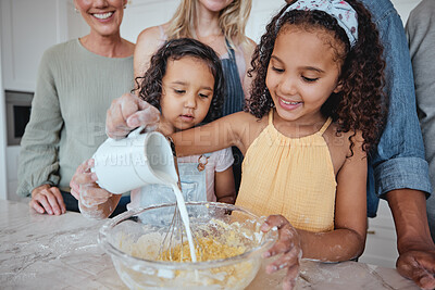 Buy stock photo Family, learning and kids pouring milk in bowl while baking in home kitchen. Education, chef and girls cooking with mother, father and grandparents teaching them how to bake delicious pastry in house