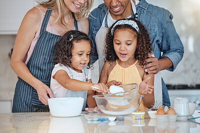 Buy stock photo Love, parents and girls in kitchen, baking and happiness for weekend break, child development and relax. Mother, father and daughters cooking, family bonding and fun with food, ingredients and home.