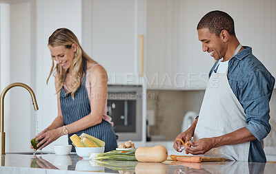 Buy stock photo Cooking, food and love with a couple in the kitchen preparing a meal together for lunch or supper in their home. Health, diet and nutrition with a diversity man and woman bonding while making dinner