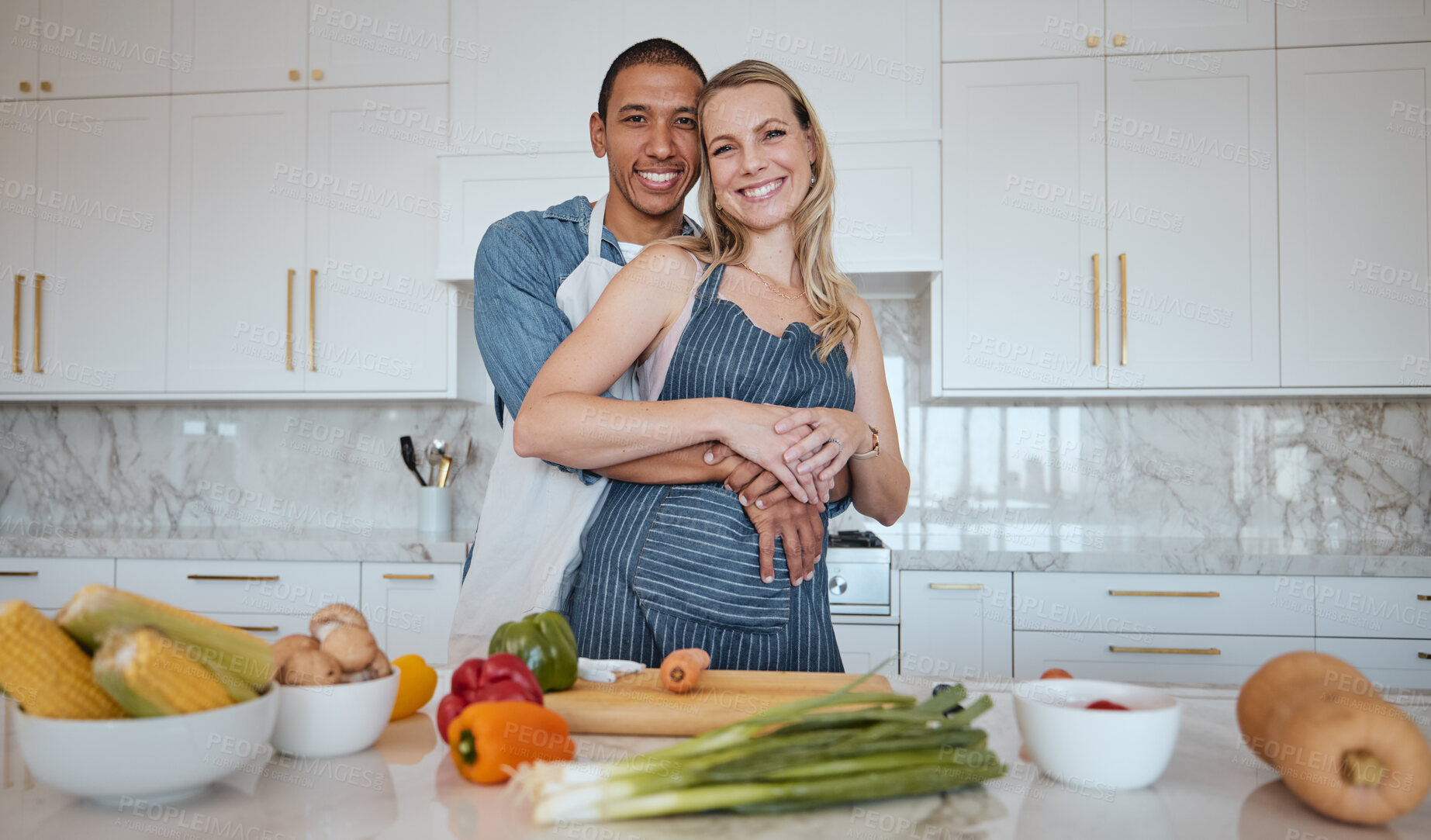 Buy stock photo Portrait, cooking and food with a couple in the kitchen together preparing a meal for lunch or supper in their home. Love, diversity and health with a man and woman making dinner while bonding