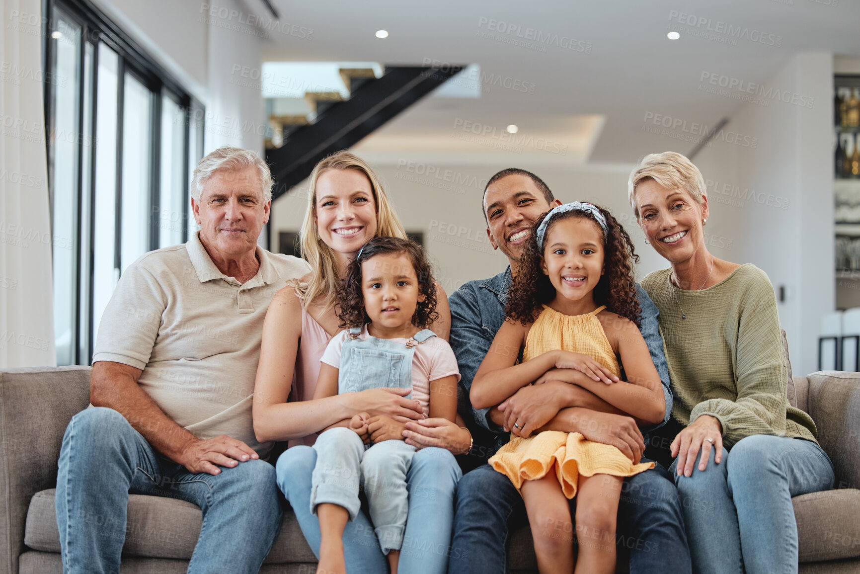 Buy stock photo Big family, smile and portrait of children, parents and grandparents together for love, care and support while on a living room couch in UK home. Smile of men, women and kids on sofa for bonding