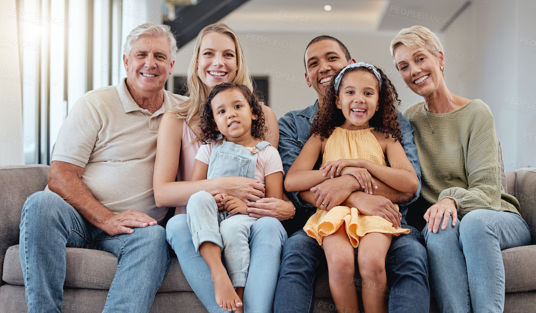 Buy stock photo Big family, portrait and relax on sofa in living room, smiling or bonding. Love, diversity or care of grandparents, father and mother with girls on couch, having fun or enjoying quality time together