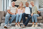 Big family, portrait and relax on sofa in home living room, smiling and bonding. Love, care and interracial couple, grandmother and grandfather sitting on couch, having fun and enjoying time together