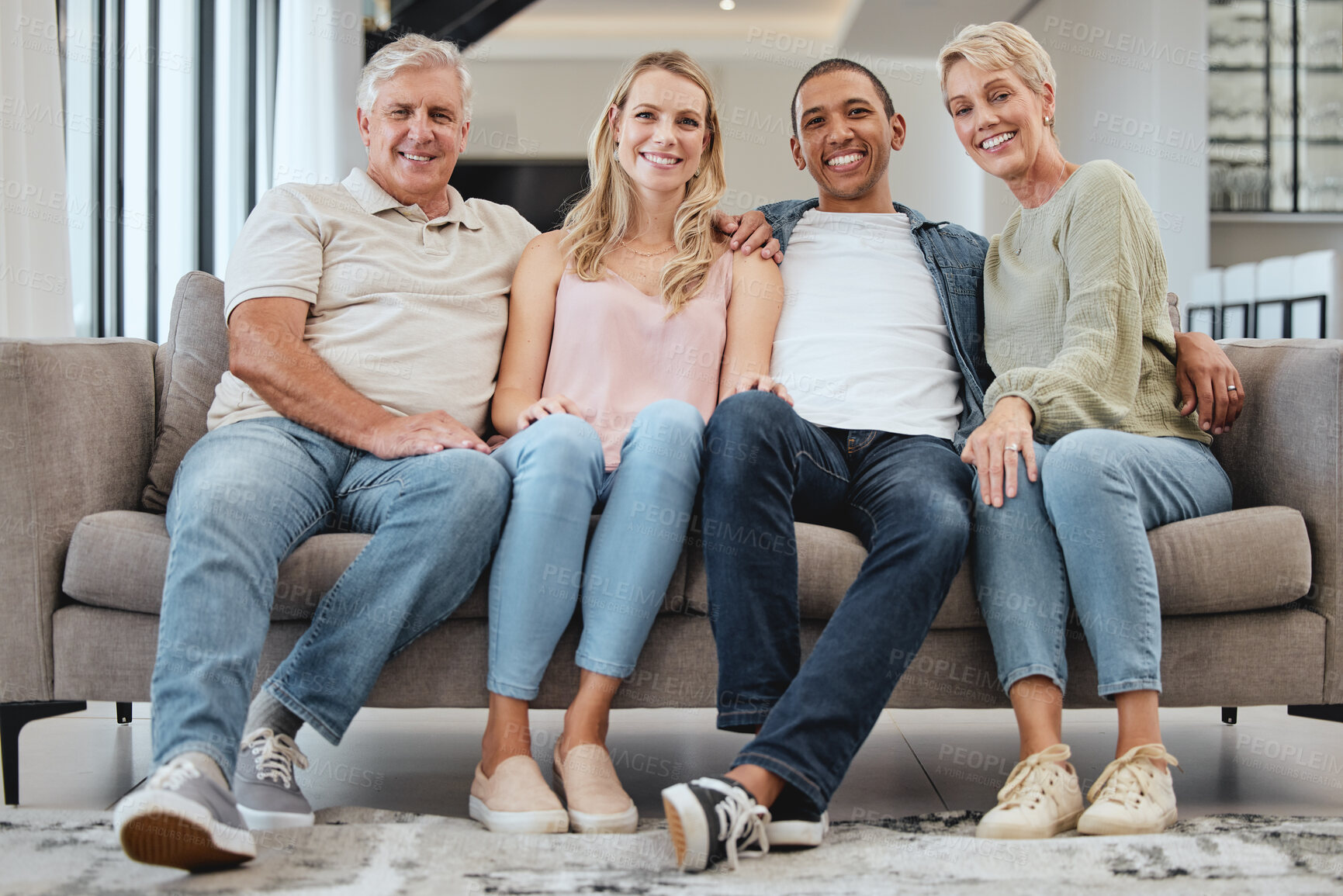 Buy stock photo Big family, portrait and relax on sofa in home living room, smiling and bonding. Love, care and interracial couple, grandmother and grandfather sitting on couch, having fun and enjoying time together