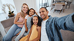Family selfie, children and portrait on living room sofa for bonding, happiness or love on social media. Interracial happy family, digital picture or smile together on social network in San Francisco