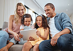 Love, sofa and couple with kids, tablet or social media for connectivity, interracial or laugh together. Family, father or mother with female children, device or watch funny videos and happy parents.