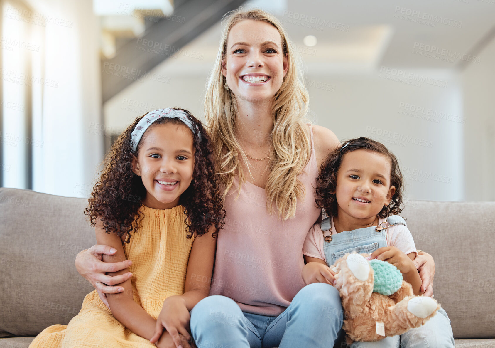 Buy stock photo Adoption, portrait and mother with kids on sofa in living room, smiling and hugging. Love, foster care and happy mom bonding with girls, having fun or enjoying quality time together in family home.