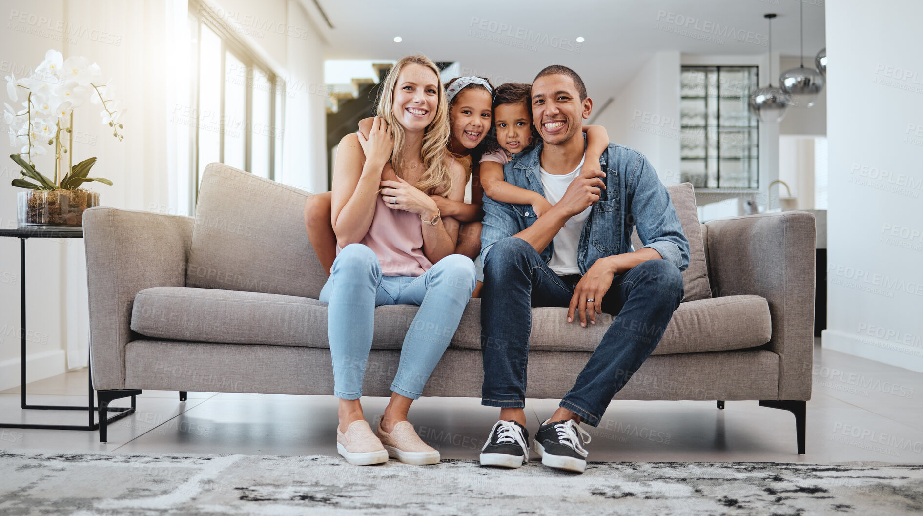 Buy stock photo Happy family, living room and portrait of a mother, dad and girl children smile on a home sofa. Relax, hug and parent care of a mom, father and kids in a interracial family house with love  