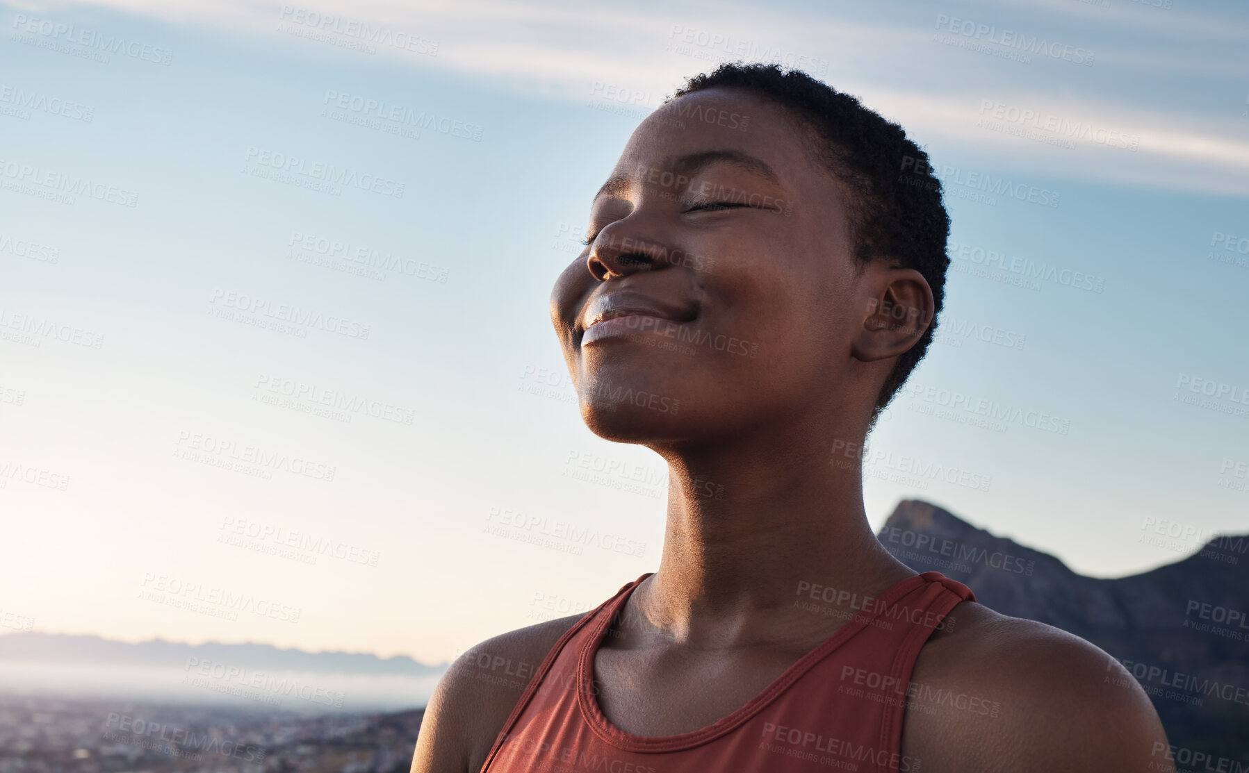 Buy stock photo Fitness, calm and breathing of black woman outdoor in nature, mountains and blue sky background for yoga wellness, meditation and zen energy. Face of girl breathing for peace, freedom and mindfulness