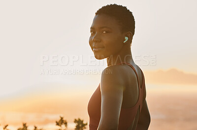Buy stock photo Portrait, black woman and fitness training with music, healthy workout or exercise in sunset. African sports girl, athlete smile and cardio training, listening or streaming motivational podcast 